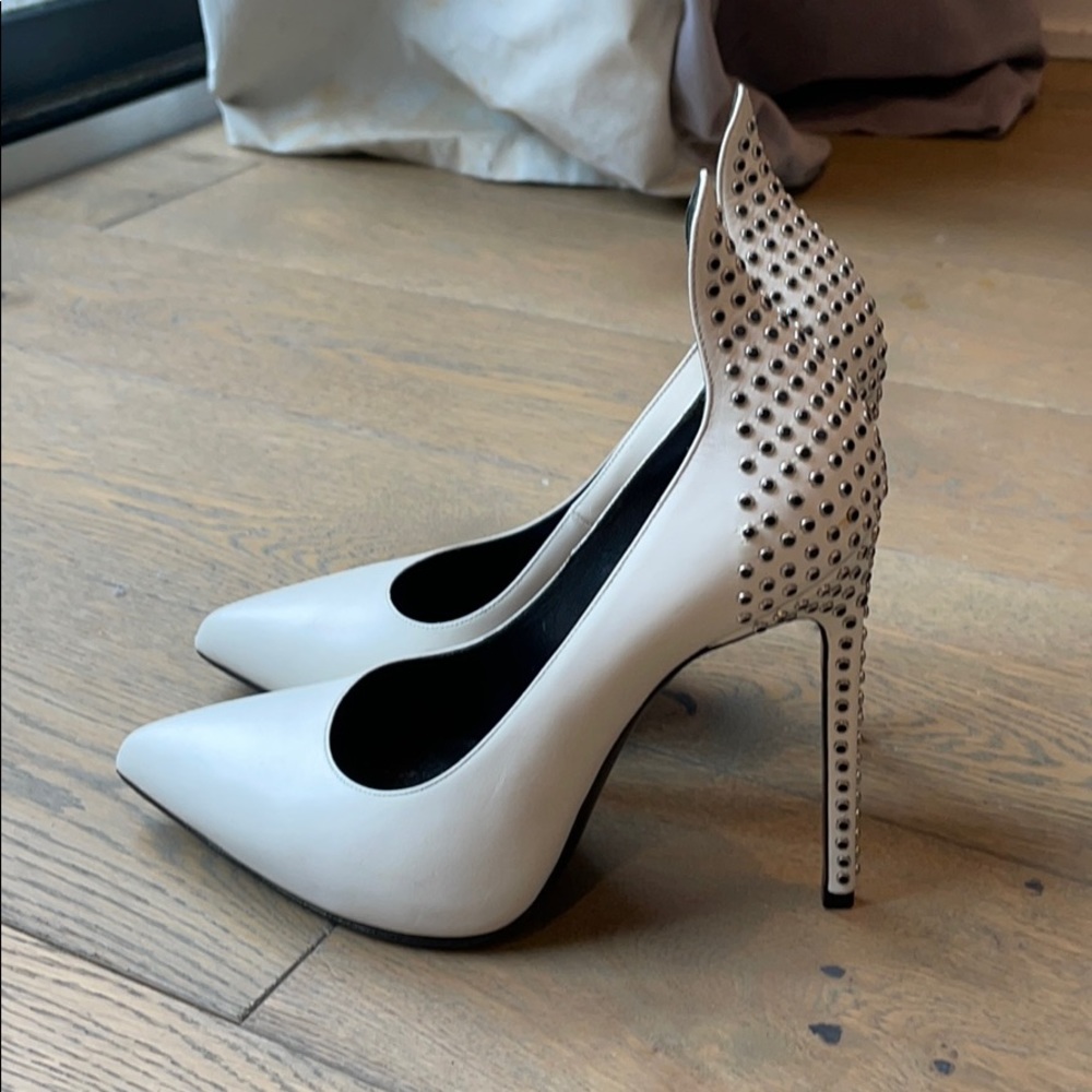 Stylish Saint Laurent pumps embedded crystals.